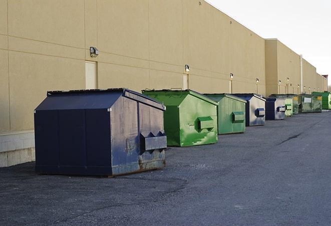 metal waste containers sit at a busy construction site in Bergman